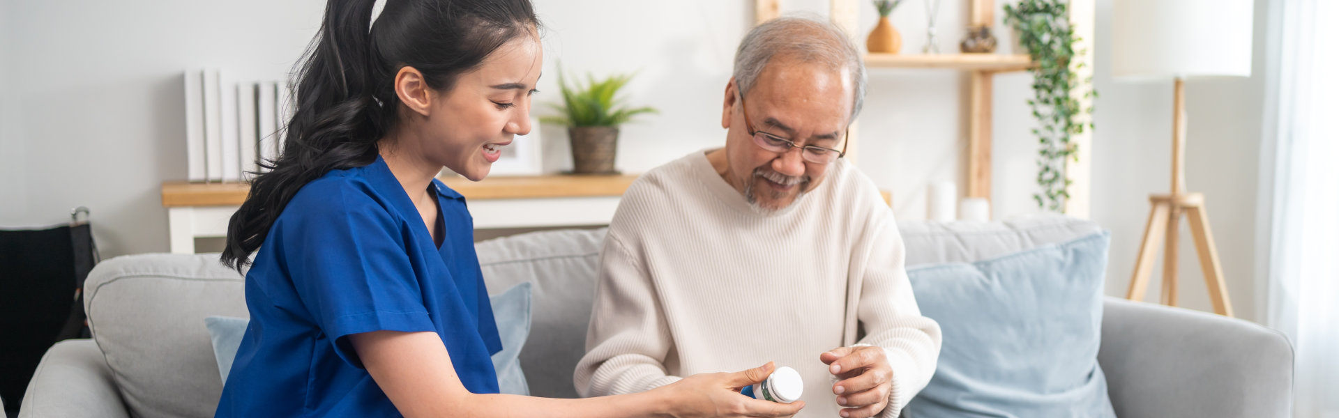 Caregiver therapist pharmacist girl hold medicine pills bottle