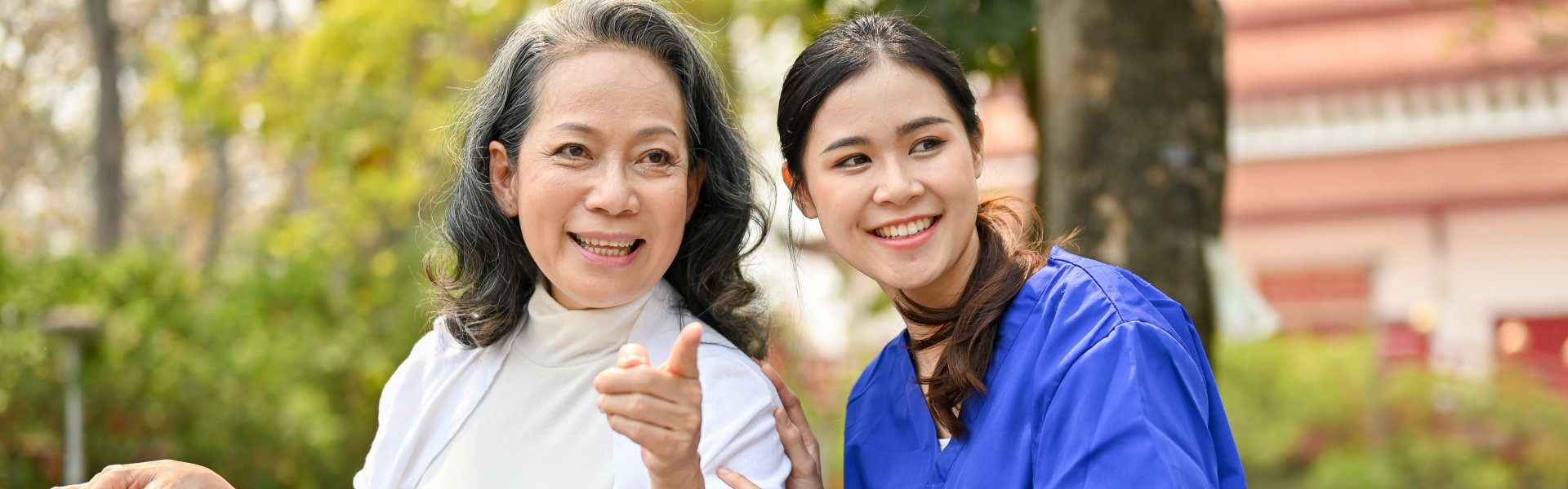 enjoys talking with her caregiver while relaxing in the park