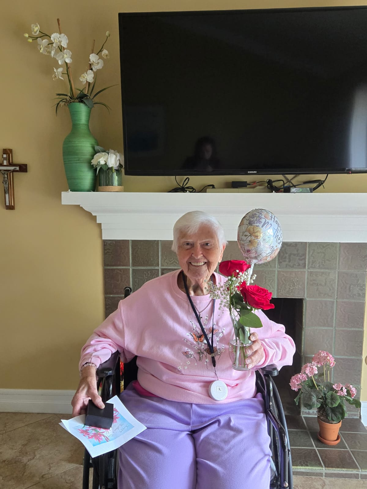 an elderly woman holding a flowers